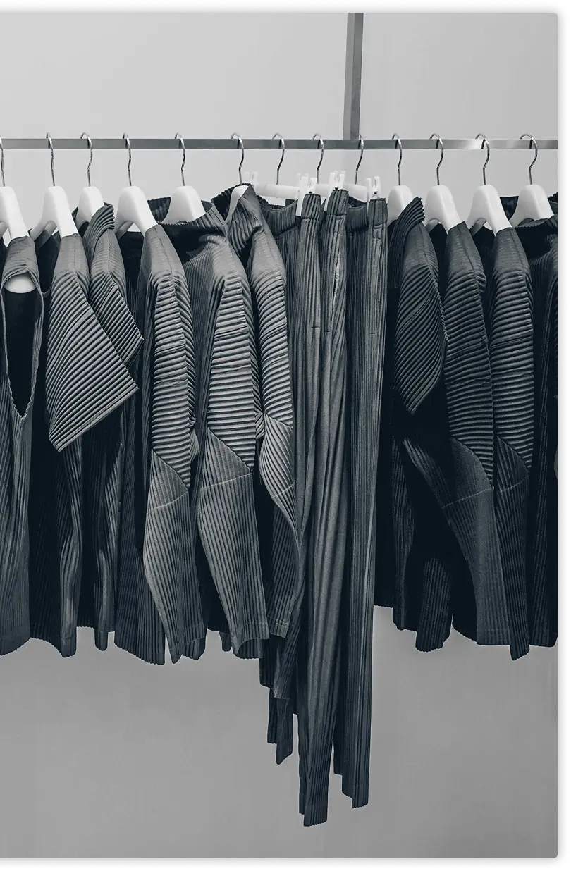 Modern retail clothing rack with black garments